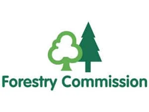 The logo of the Forestry Commission with a stylised green broadleaf tree and a conifer tree above the words Forestry Commission in green text on a white background.