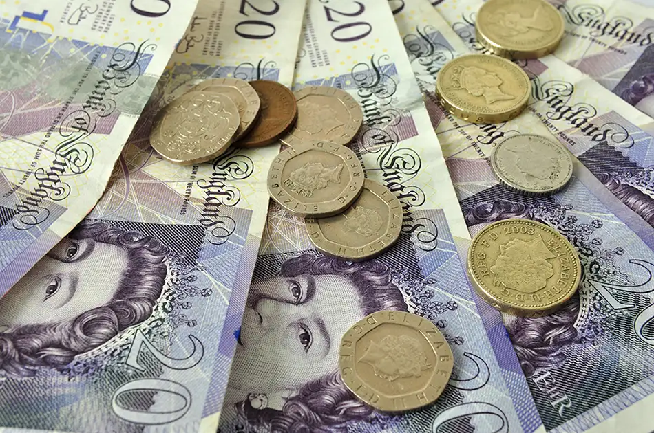 British currency coins and notes mixed together