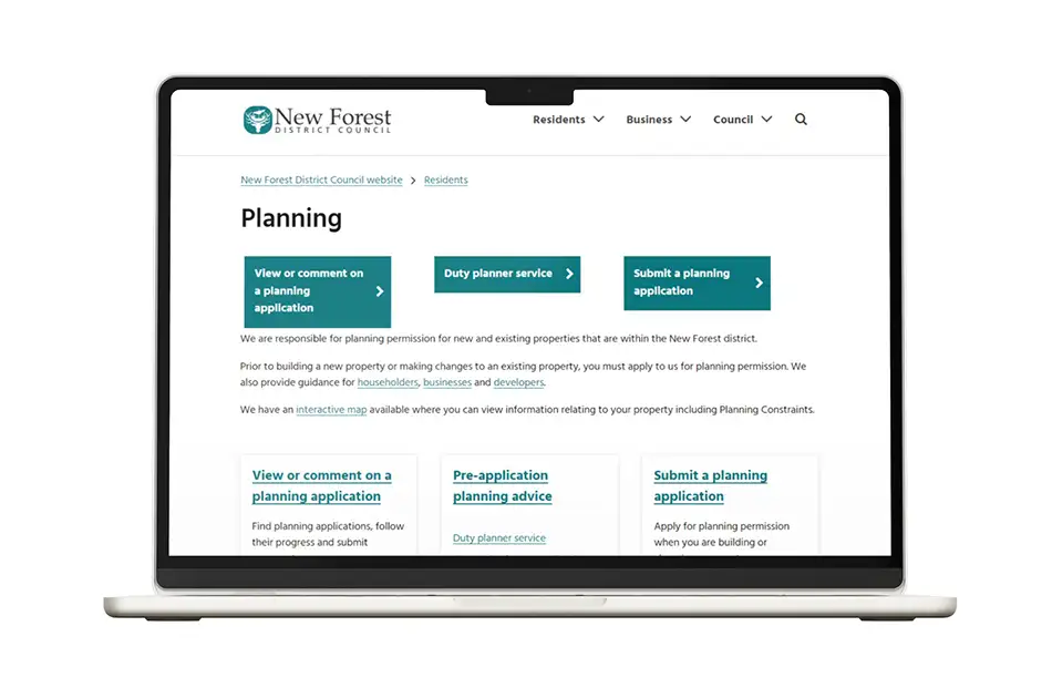 MacBook Front View showing the NFDC Planning Homepage