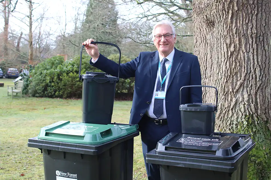 Cllr geoffrey blunden, portfolio holder for environment and sustainability, with the new wheelie bins copy